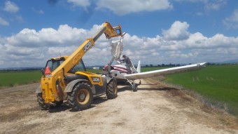 2015 - A Loadall 531-70 fills a light aircraft in Portugal with 400 rice seed before it is sown from the air